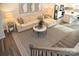 Spacious living room boasts a light beige sectional sofa and a large area rug at 7232 Hodges Meadow Ln, Charlotte, NC 28213