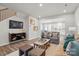 Inviting living room with stylish furniture, hardwood floors, and an open layout leading into the bright kitchen at 7232 Hodges Meadow Ln, Charlotte, NC 28213