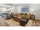 Comfortable living room with neutral tones, stylish decor, and seamless flow into the bright, modern kitchen at 7232 Hodges Meadow Ln, Charlotte, NC 28213