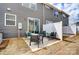 Back patio with modern outdoor seating, a privacy fence, and low-maintenance landscaping at 7232 Hodges Meadow Ln, Charlotte, NC 28213
