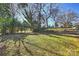 Spacious backyard with mature trees and shed at 738 Brockbank Rd, Charlotte, NC 28209