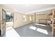 Spacious basement area with ample natural light, a workbench, and an exterior access door at 738 Brockbank Rd, Charlotte, NC 28209
