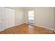 Hardwood floors and double closet in this bedroom at 738 Brockbank Rd, Charlotte, NC 28209