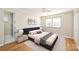 Serene bedroom with hardwood floors, natural light, and neutral decor at 738 Brockbank Rd, Charlotte, NC 28209