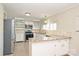 Spacious kitchen featuring granite countertops, stainless steel appliances, and white cabinetry at 738 Brockbank Rd, Charlotte, NC 28209