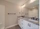 Bathroom featuring double sinks, granite countertops, a tub, and a separate shower at 8690 Crestwood Dr, Mount Pleasant, NC 28124