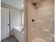 Bright bathroom with a soaking tub and a shower at 8690 Crestwood Dr, Mount Pleasant, NC 28124