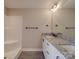 Bathroom featuring double sinks, granite countertops, a tub, and a separate shower at 8690 Crestwood Dr, Mount Pleasant, NC 28124