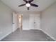 A bedroom featuring a ceiling fan, closet, wood flooring and white trim at 8690 Crestwood Dr, Mount Pleasant, NC 28124