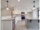 Bright kitchen featuring white cabinetry, granite countertops, and stainless steel appliances at 8690 Crestwood Dr, Mount Pleasant, NC 28124