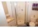 Bathroom with granite vanity, corner shower, and toilet at 1028 Sharon Towns Dr, Charlotte, NC 28210