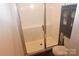 Modern bathroom with a walk-in shower and gray vanity at 1028 Sharon Towns Dr, Charlotte, NC 28210