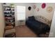 Small bedroom with twin bed, shoe storage, and bright decor at 1028 Sharon Towns Dr, Charlotte, NC 28210