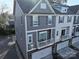 Gray townhome with balcony and two-car garage at 1028 Sharon Towns Dr, Charlotte, NC 28210