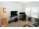 Bright home office with built-in shelving and plenty of natural light at 1028 Sharon Towns Dr, Charlotte, NC 28210