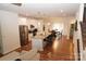 Open concept kitchen with island and hardwood floors at 1028 Sharon Towns Dr, Charlotte, NC 28210