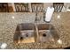 Double stainless steel sink in granite countertop at 1028 Sharon Towns Dr, Charlotte, NC 28210