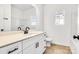 Bathroom with white vanity, black fixtures, and light beige countertop at 1077 Gibson St, Albemarle, NC 28001