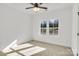 Well lit bedroom with carpet, ceiling fan and large windows at 1077 Gibson St, Albemarle, NC 28001