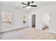 Spacious bedroom with carpet, ceiling fan and en-suite bathroom at 1077 Gibson St, Albemarle, NC 28001