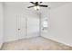 Bright bedroom with neutral walls and carpet flooring at 1077 Gibson St, Albemarle, NC 28001