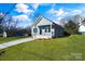 House exterior with gray siding and a lawn at 1077 Gibson St, Albemarle, NC 28001