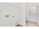 Laundry room with shelving and exterior access at 1077 Gibson St, Albemarle, NC 28001