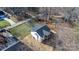 House nestled amongst the trees with a large grassy area at 115 Brentwood Dr, Maiden, NC 28650