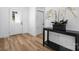 Bright entryway with hardwood floors, white walls, and a storage closet at 115 Brentwood Dr, Maiden, NC 28650