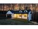 Two-story house with a white exterior, black garage door, and front porch at 115 Brentwood Dr, Maiden, NC 28650