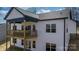 Elevated back deck with wooden railings and sliding glass doors at 115 Brentwood Dr, Maiden, NC 28650