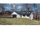 Charming house with a white exterior and a black roof at 115 Brentwood Dr, Maiden, NC 28650