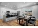 Modern kitchen with white cabinets, island, and breakfast bar at 115 Brentwood Dr, Maiden, NC 28650