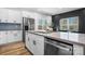 Modern kitchen with white cabinets, stainless steel appliances, and a large island at 115 Brentwood Dr, Maiden, NC 28650