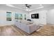 Spacious living room featuring hardwood floors and a large TV at 115 Brentwood Dr, Maiden, NC 28650