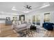 Spacious living room with L-shaped sofa and access to a deck at 115 Brentwood Dr, Maiden, NC 28650
