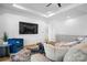 Open living area with a large TV, comfortable seating, and hardwood floors at 115 Brentwood Dr, Maiden, NC 28650