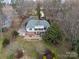 Charming home featuring a large backyard with a patio perfect for outdoor entertaining and lush landscaping at 124 Muirfield Dr, Kings Mountain, NC 28086