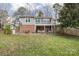 The house's backyard offers a patio, outdoor seating, and a vast lawn space at 124 Muirfield Dr, Kings Mountain, NC 28086