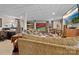 Large, carpeted finished basement with bunk beds, seating area, desk, and a television at 124 Muirfield Dr, Kings Mountain, NC 28086