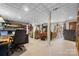 The spacious basement area has carpet, a TV area, and desk area at 124 Muirfield Dr, Kings Mountain, NC 28086