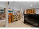 A view of the finished basement area, with a TV and plenty of space for entertaining at 124 Muirfield Dr, Kings Mountain, NC 28086