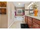 Cozy bathroom with a built-in bathtub, granite countertop vanity, tile backsplash, and neutral paint at 124 Muirfield Dr, Kings Mountain, NC 28086
