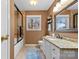 This bathroom features tile flooring, granite countertops, and a shower-tub with glass doors at 124 Muirfield Dr, Kings Mountain, NC 28086