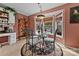 Charming dining area with glass table, ornate chairs, bay window, and decorative accents at 124 Muirfield Dr, Kings Mountain, NC 28086