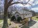 Charming two-story home with a well-manicured lawn and mature trees at 124 Muirfield Dr, Kings Mountain, NC 28086