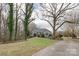 Charming home with a well-maintained lawn and mature trees creating a park-like setting at 124 Muirfield Dr, Kings Mountain, NC 28086