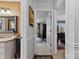 Hallway featuring a vanity with granite countertops leading to a Primary bedroom at 124 Muirfield Dr, Kings Mountain, NC 28086