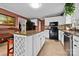 Spacious kitchen featuring an island, white cabinetry and granite countertops at 124 Muirfield Dr, Kings Mountain, NC 28086