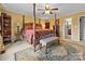 Comfortable main bedroom suite featuring a canopy bed, and natural light at 124 Muirfield Dr, Kings Mountain, NC 28086